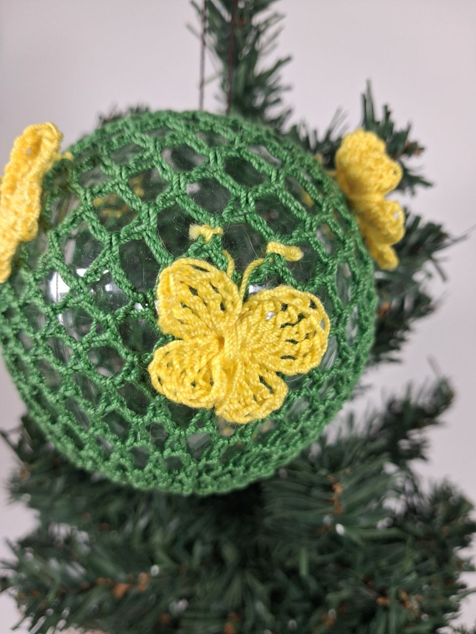 Green Crochet Christmas Bauble with butterfly